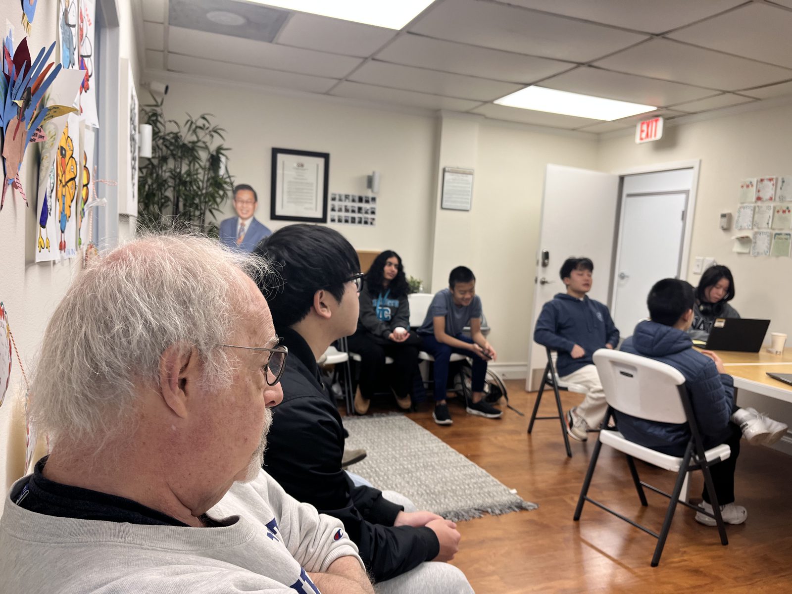 A mentor with Life Skills Academy students at the AASuccess office