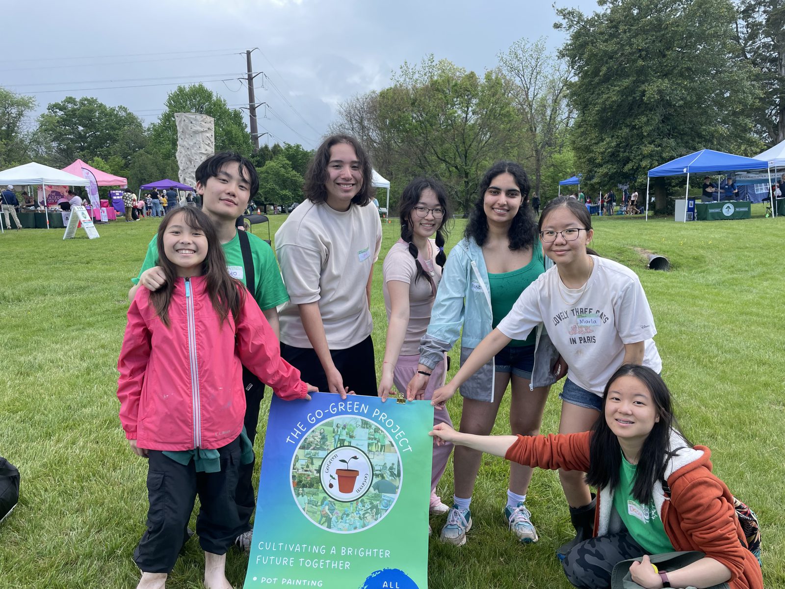 Students with their Go Green banner at the Fairfax Earth Day Festival