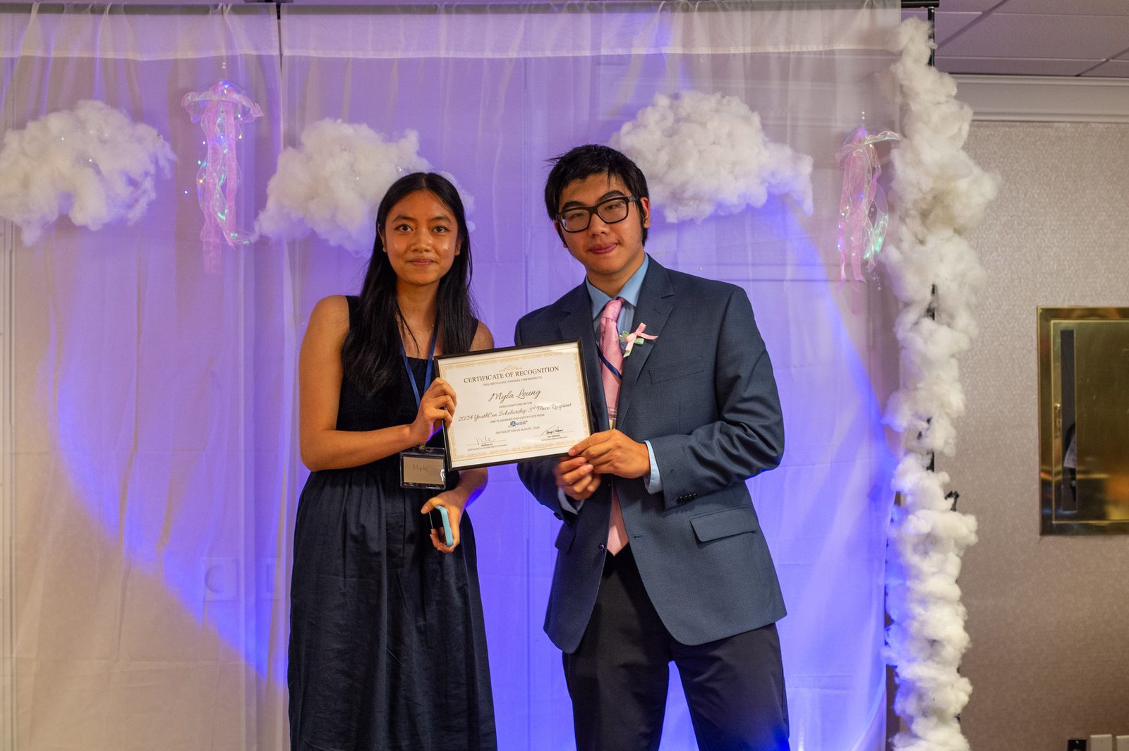 YouthCon 2024 scholarship recipients with their certificates