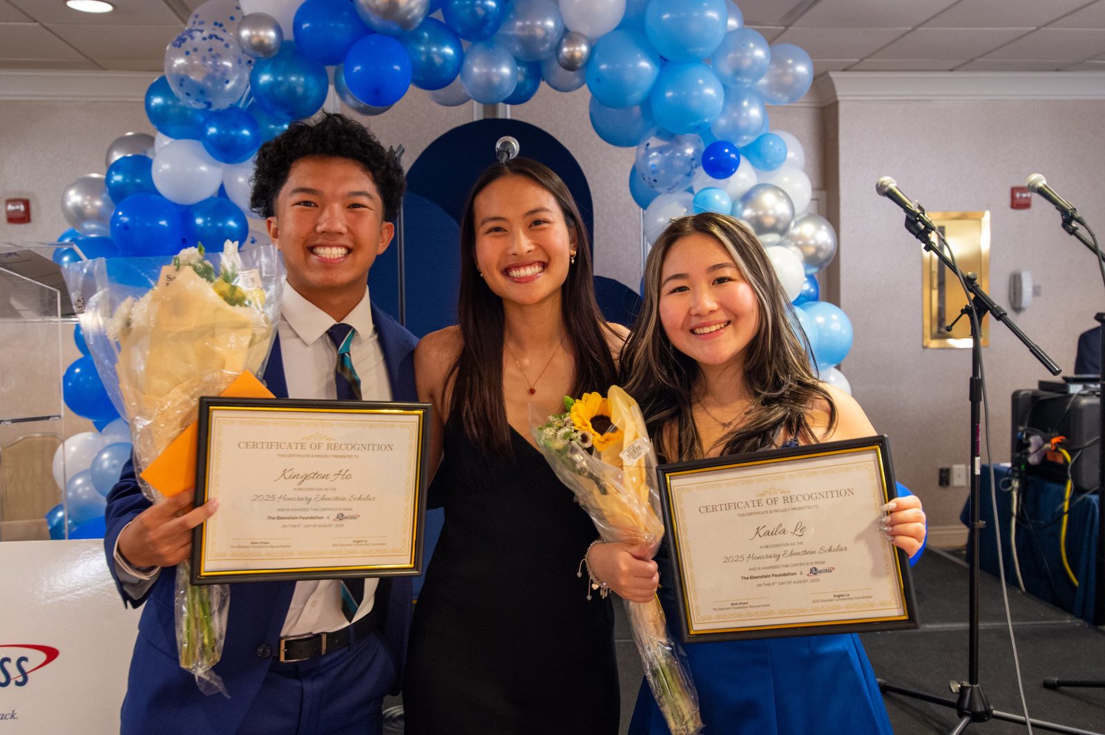 Ebenstein Scholarship winners with their certificates and flowers